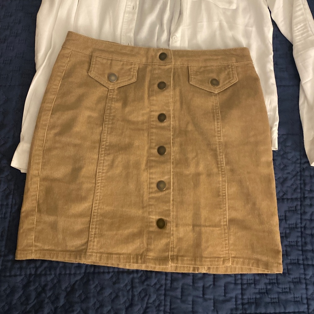 Mini brown button up skirt.
